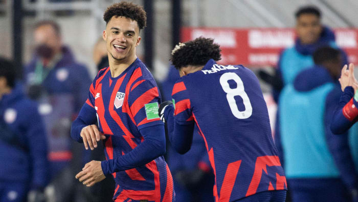 Antonee Robinson and Weston McKennie celebrate the USMNT's goal vs. El Salvador